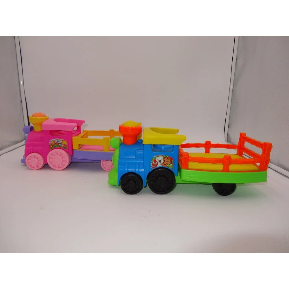 Fisher Price Little People Pink Musical Zoo Train and Musical Safari Train Set
